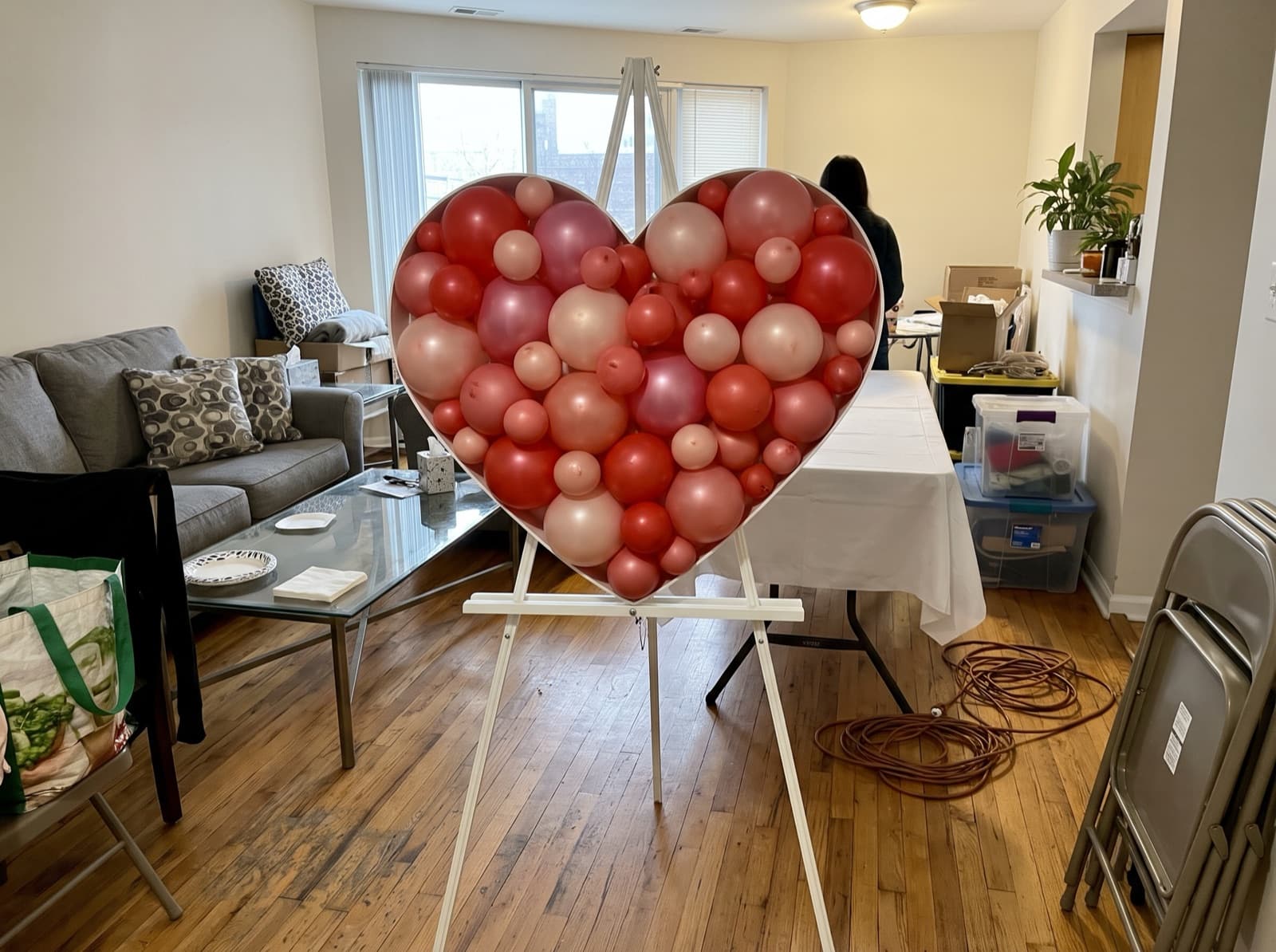 Red and pink balloon mosaic heart on an easel