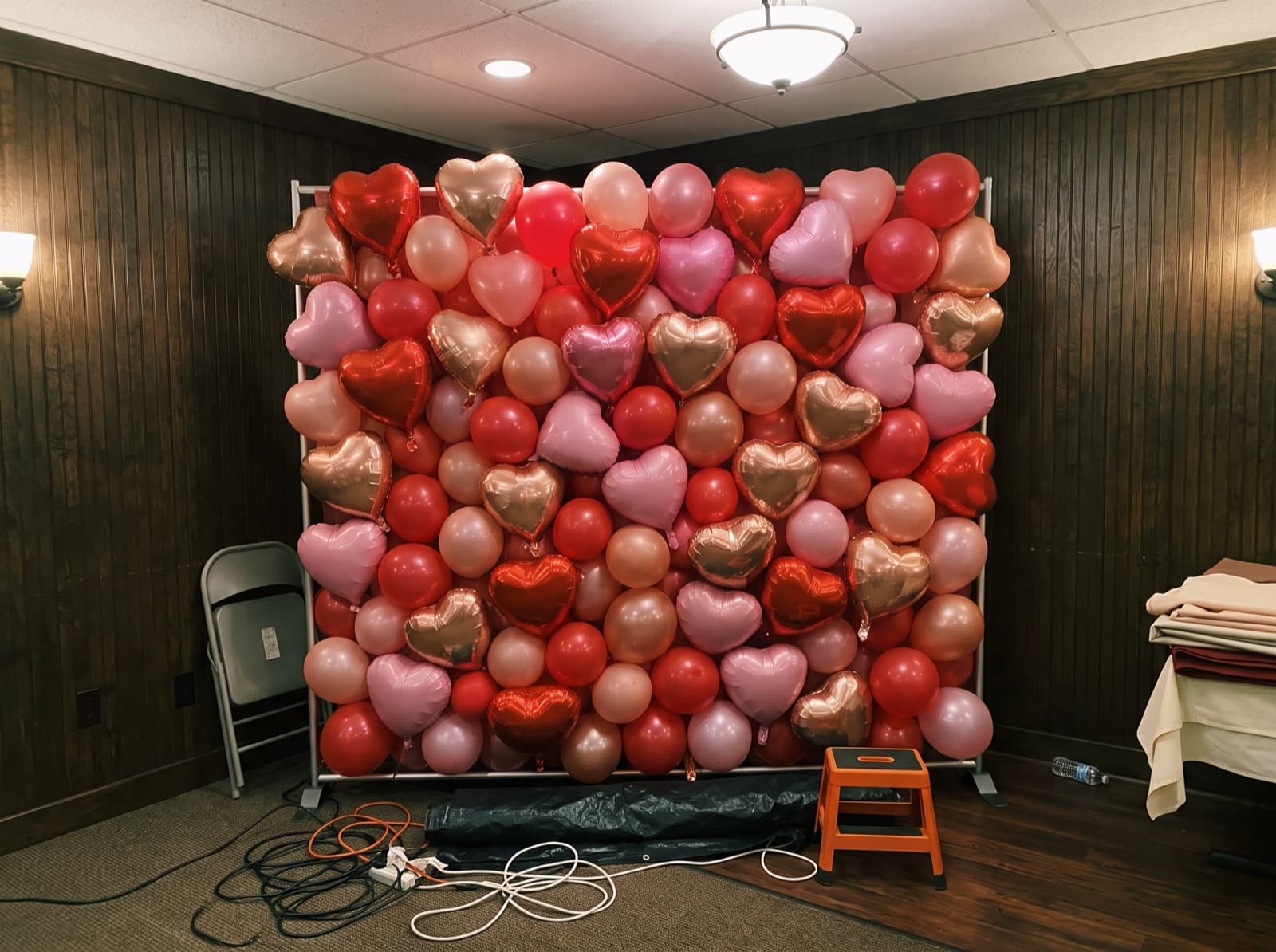 Foil heart balloon wall in red, pink and rose gold